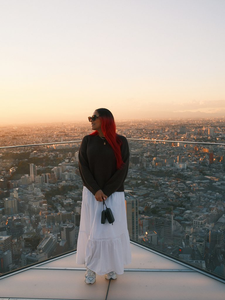 Image of traveler standing on Shibuya Sky's Sky Edge featured in a guide to the best observation decks in Tokyo