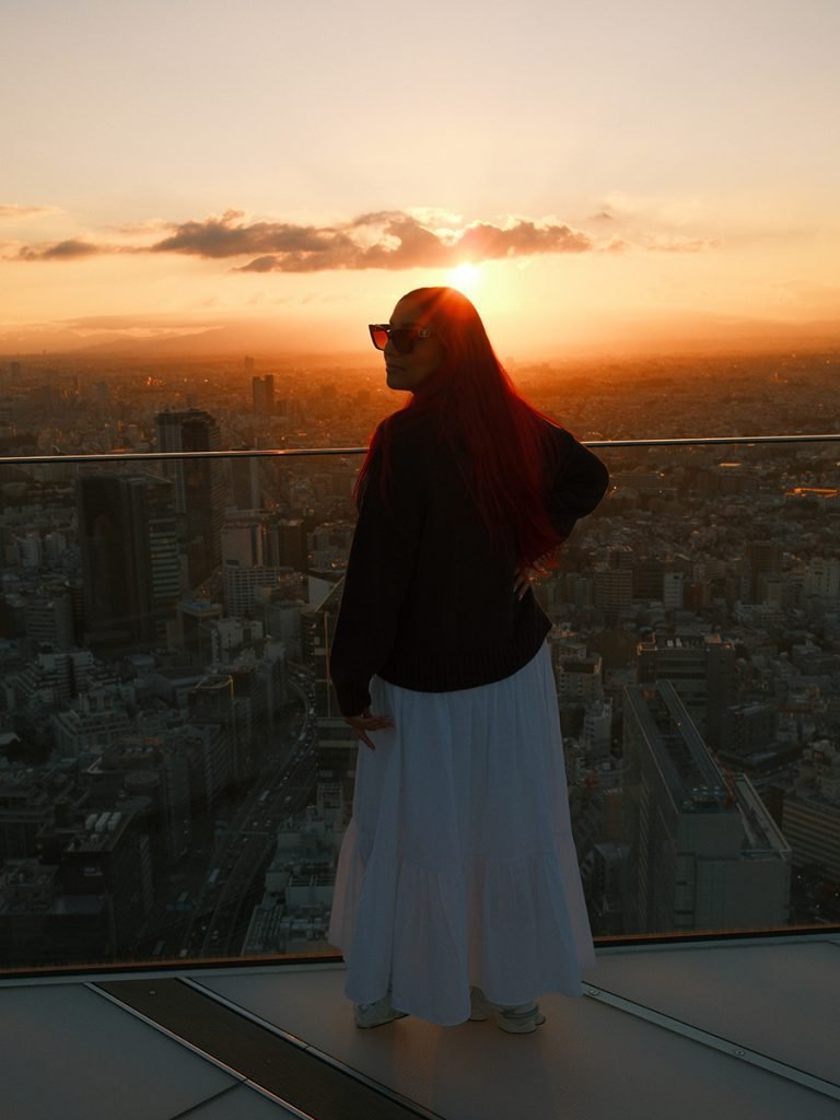Image of traveler at Shibuya Sky featured in a guide to the best views in Tokyo